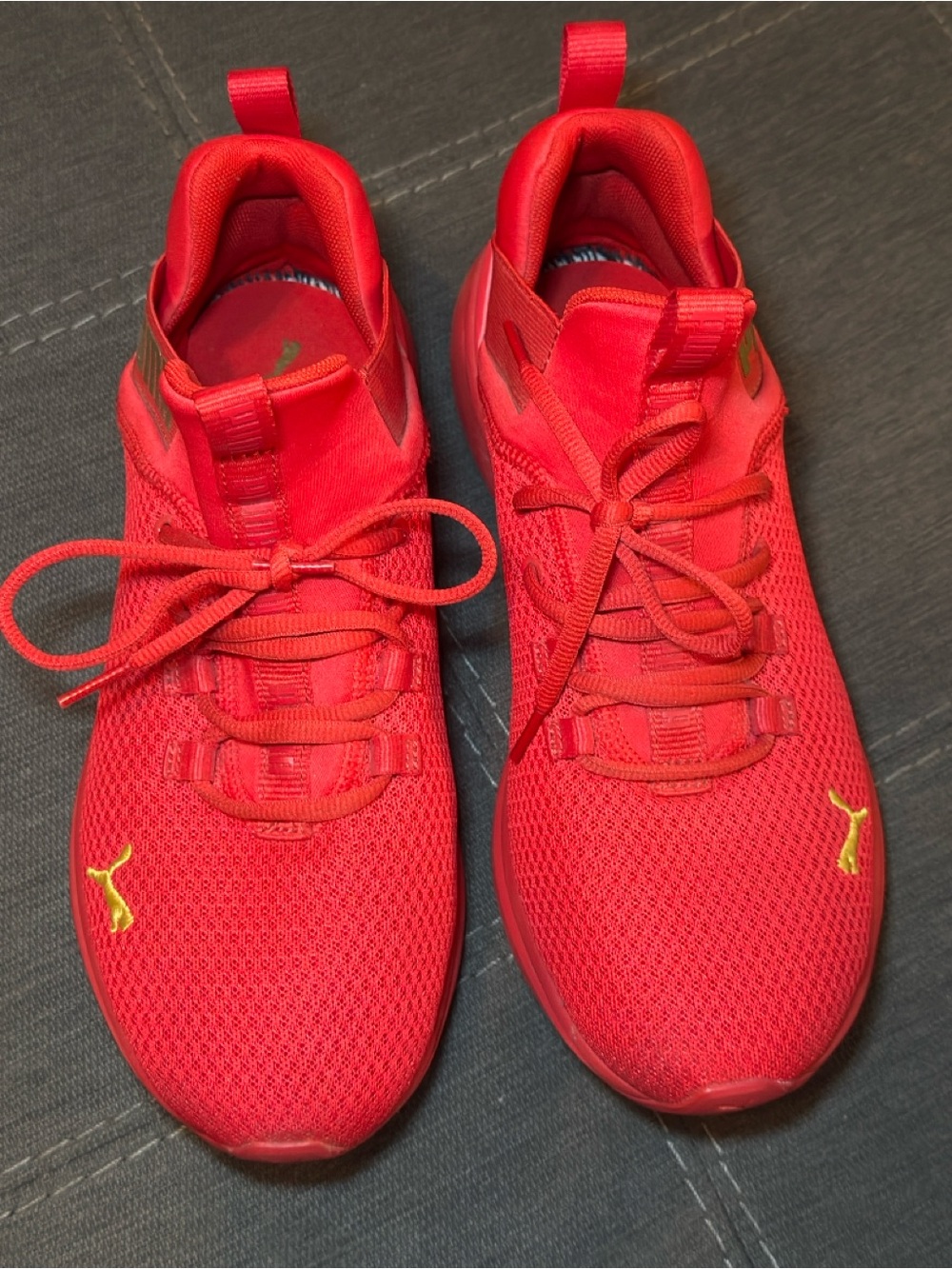 Puma Men’s Red Athletic Shoes with Yellow Logo Accents